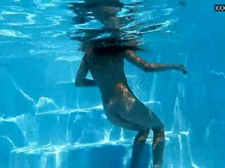 Petite brunette girlfriend models her swimming skills