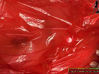 Extreme plastic fetish play with a dominant German MILF in latex gear