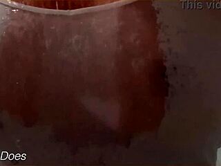 The wife bathes in the shower, her wet shirt clinging to big tits, homemade voyeur captures every detail.