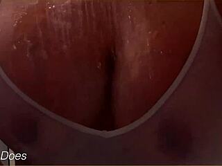 The wife bathes in the shower, her wet shirt clinging to big tits, homemade voyeur captures every detail.