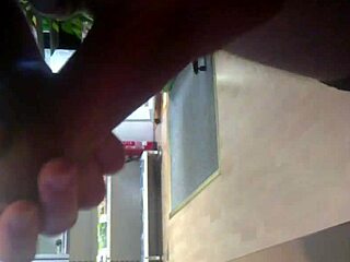 I'm stroking my cock in the internet cafe