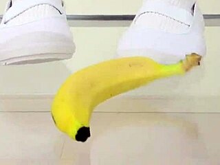 Japanese asian girl performs food crush fetish by crushing a banana