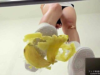 Japanese asian girl performs food crush fetish by crushing a banana
