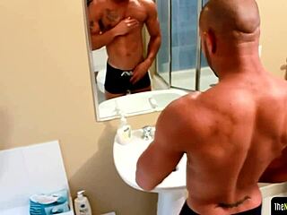 Tattooed black jock wanks swollen cock solo