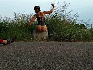 shooting porn on the edge of a road with shaved pussy and small tits exposed