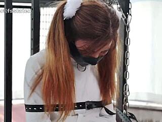 asian latex catsuit woman bound tight in straitjacket bondage