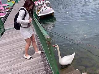 Girl in miniskirt enjoys boat ride at lake 😊