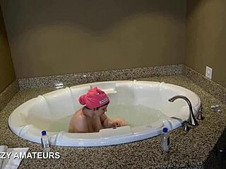 The super nerd with big tits soaks in a steamy bubble bath