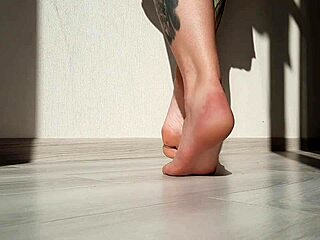 dominatrix nika shows off her beautiful feet in a sexy domination session, focusing on toes and fetish play.