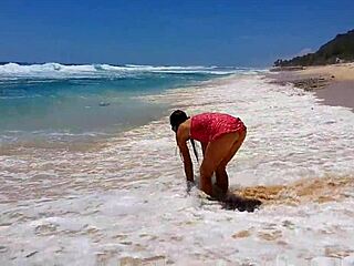 My sandy ass shines with a red butt plug at paradise beach