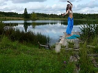Mature lady in water poses seductively in lingerie