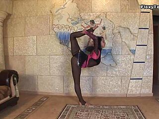 Teen gymnast stretches legs displaying huge tits