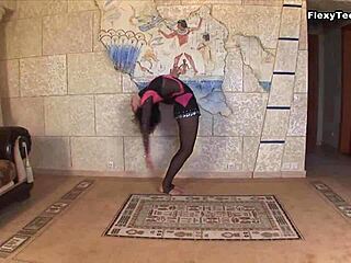 Teen gymnast stretches legs displaying huge tits