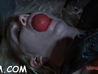 Why is this sexy blonde bombshell gagging on toys?