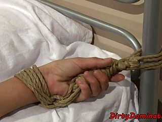 Restrained sub babe pussytoyed by lezdom