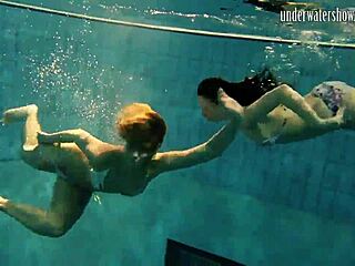 brunette babe poses erotically underwater in swimming pool