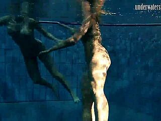 brunette babe poses erotically underwater in swimming pool