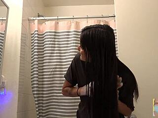 Beautiful woman dyes her hair black in front of mirror