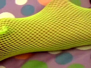 This chick in fishnets is toying her pussy hole so cutely