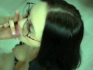 brunette girl gives a sensual blowjob to her man and gets a facial