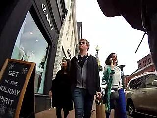 A girl strolling bare-breasted in public spaces