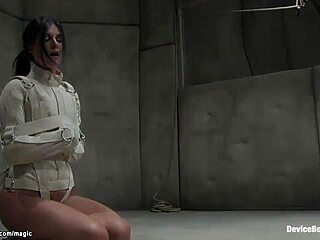 A naughty mature woman's pussy is played with in a bizarre room while restrained