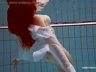 Russian girlfriend with large breasts undresses in pool