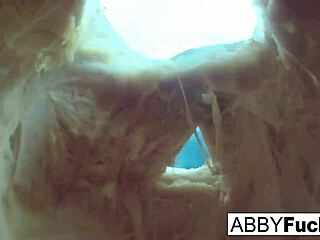 Abigail carves a pumpkin and indulges in solo pleasure, showcasing her big tits and brunette beauty.