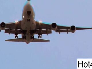 flight attendant's big fake tits bounce while taking cockpit cock