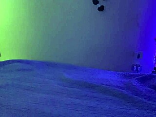 Is the tattooed woman with big ass fingering herself on bed because her vagina is so wet?