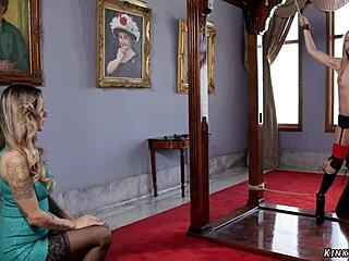 married couple dominates and bangs their bound slave