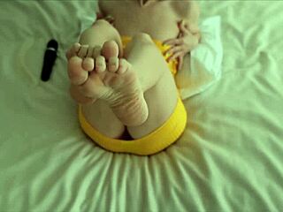 lana in yellow dress plays with herself