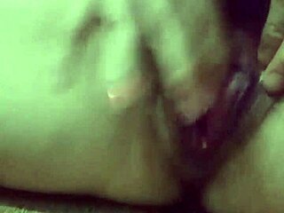 A young girl exploring her body with toys in private