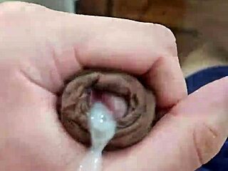 Young boy with a big cock gives a handjob and cums