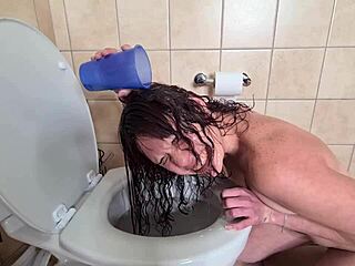 check out this petite teen humiliating herself in the toilet