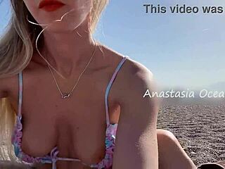 Sexy blonde poses nude on beach, showing shaved pussy and boobs