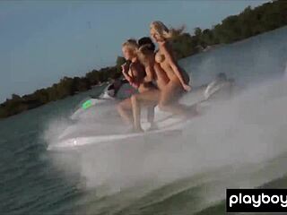 Tattooed beauty and her nude friends ride jetskis outdoors