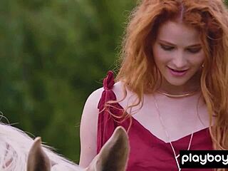 Redhead Latvian Heidi Romanova strips to show big boobs outdoors