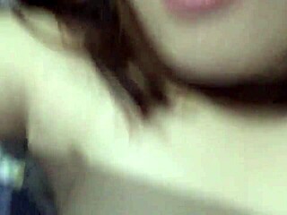 Horny Filipina Girlfriend Teases in Rainy Homemade Clip