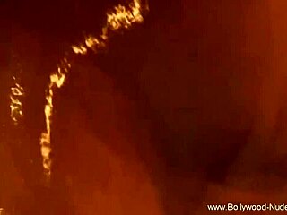 she gets nude and plays seductively, enjoying the erotic ritual with teasing dances