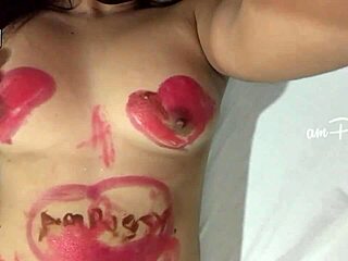 Hey, watch this amateur girl paint her naked Asian body with lipstick!