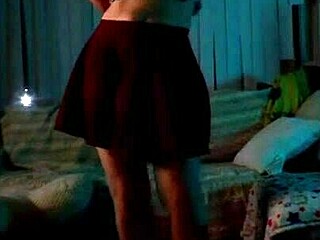 Brunette beauty Noita performs a solo striptease for her friend