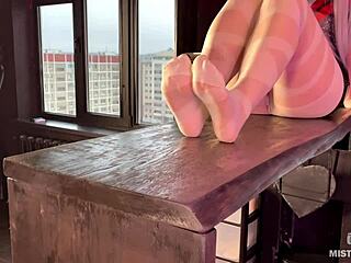 goddess in white pantyhose wiggling her nylon feet and toes on a table