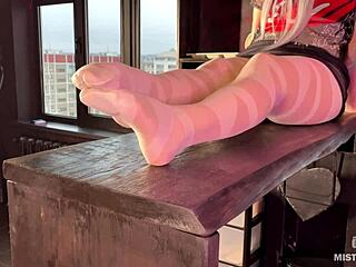 Close-up view of a goddess in pantyhose teasing toes