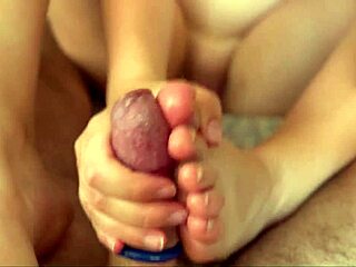 Young Babe’s Closeup Footjob on Cock with Cumshot Explosion