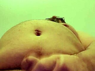 Solo woman strokes her pussy intensely in a hotel room, building to climax.