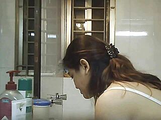 Watching an Indian beauty bathe in secret shower footage