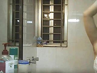 Watching an Indian beauty bathe in secret shower footage