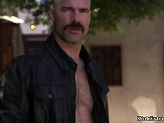 Biker unchains bound blonde for rough bdsm fucking and submission in a chained setup.