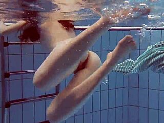 doctor examines teen in hospital uniform